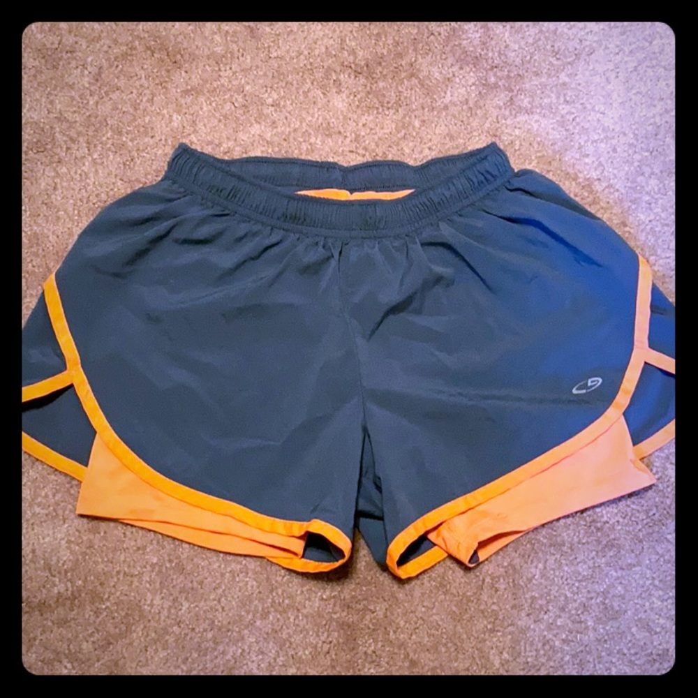 Running shorts with spandex material underneath